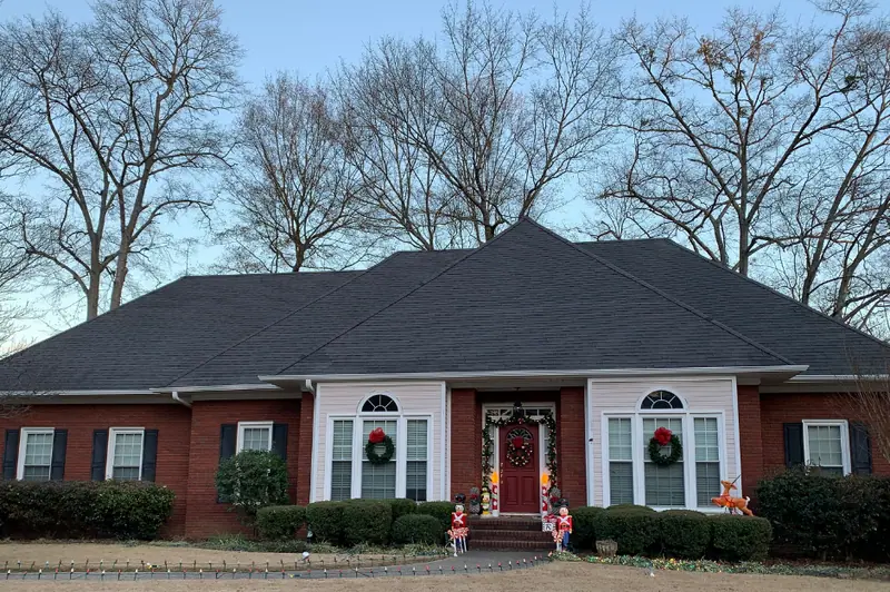 Brick ranch home with a dark architectural shingle hip roof, a Mosqueda Construction job in the Birmingham area