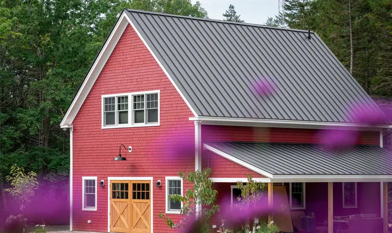 House with a charcoal standing seam metal roof